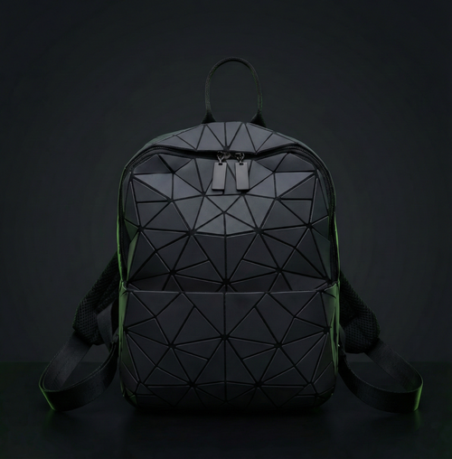 Geometric backpack with a black and green color scheme on a dark background