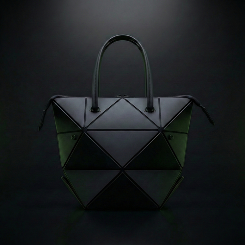 Geometric handbag with a black and green color scheme on a dark background